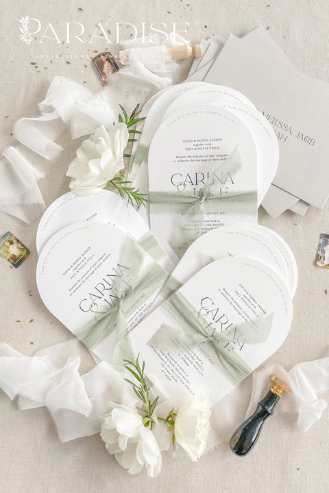 Our arched wedding invitation suite is perfect for couples seeking a modern yet romantic stationery style. The smooth arch shape brings a contemporary edge, while the sage green silk ribbon adds a soft, botanical touch. Printed on premium white matte cardstock, this suite features clean, modern typography and delicate detailing that beautifully complements any wedding theme - from garden to destination to modern minimalist celebrations.