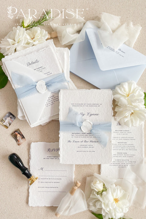 Elegant, romantic, and handmade with love - our fine art wedding invitation suite is crafted from luxury cotton deckled-edge paper and finished with a delicate powder blue chiffon ribbon and white wax seal. The soft blue tones and artisanal textures make this suite perfect for fine art, coastal, or destination weddings, offering a serene yet refined aesthetic that feels effortlessly graceful.