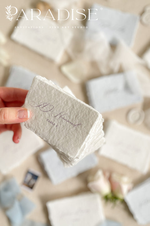 Add a touch of fine-art elegance to your celebration with our colored handmade paper place cards, crafted from premium cotton rag paper and finished with soft, natural deckled edges. Each card features beautifully flowing calligraphy and comes in a curated palette of soft, romantic hues - perfect for weddings, dinner parties, bridal showers, or luxury events. Designed to elevate any tablescape, these artisanal place cards bring warmth, texture, and timeless beauty to your seating arrangements.