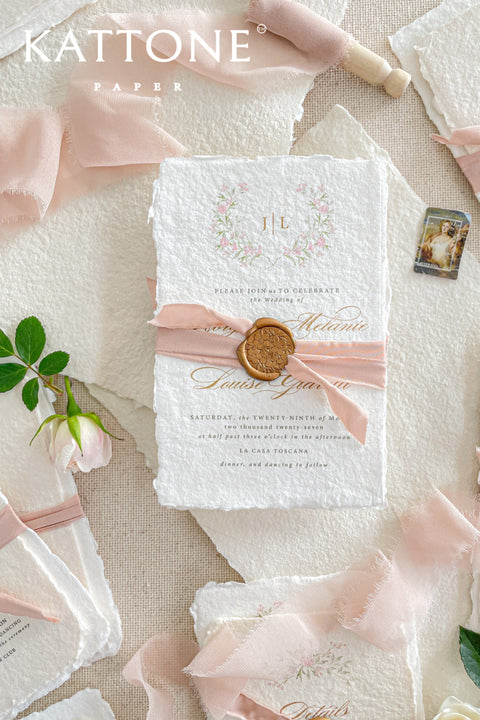 Announce your special day with the delicate, romantic charm of these handmade wedding invites. Perfect for a summer wedding, this suite features a soft and beautiful dusty pink color palette and delicate floral artwork. Each invitation is individually crafted, giving it a unique, tactile feel that you and your guests will appreciate. The combination of handcrafted artistry and a fresh, romantic design sets a beautiful tone for your celebration.