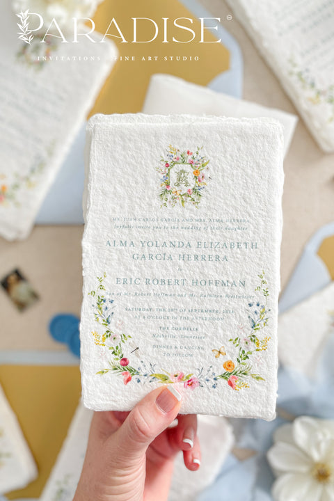 This exquisite wedding invitation set offers a blend of timeless charm and whimsical artistry. Each suite is printed on a luxurious handmade paper from our cotton rag suite, providing a rich, tactile feel. A delicate tassel is included with each invite, adding a playful pop of color and charm. The beautiful watercolor floral invites create a stunning and romantic preview of your special day.