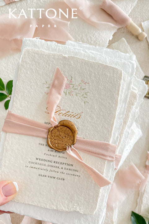 Announce your special day with the delicate, romantic charm of these handmade wedding invites. Perfect for a summer wedding, this suite features a soft and beautiful dusty pink color palette and delicate floral artwork. Each invitation is individually crafted, giving it a unique, tactile feel that you and your guests will appreciate. The combination of handcrafted artistry and a fresh, romantic design sets a beautiful tone for your celebration.