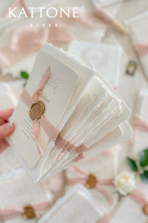 Announce your special day with the delicate, romantic charm of these handmade wedding invites. Perfect for a summer wedding, this suite features a soft and beautiful dusty pink color palette and delicate floral artwork. Each invitation is individually crafted, giving it a unique, tactile feel that you and your guests will appreciate. The combination of handcrafted artistry and a fresh, romantic design sets a beautiful tone for your celebration.