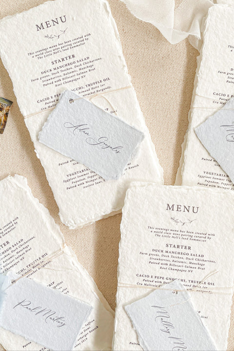 Bring timeless elegance to your wedding reception with our handmade paper wedding menus, beautifully crafted from 100% cotton rag paper with naturally torn deckled edges. Each menu is a piece of art - refined, tactile, and designed to elevate your table styling with understated luxury. Featuring elegant typography and paired with delicate personalized name tags.