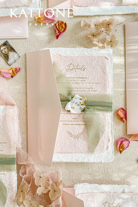 Elevate your wedding announcement with this exquisite invitation suite, meticulously crafted for a truly memorable impression. This set combines the luxurious, textured feel of handmade paper with the sophisticated details of premium silk ribbons and personalized wax seals. The entire suite is elegantly enclosed in beautiful coco linen petite pink envelopes, adding a final touch of charm and romance that your guests will adore from the moment they open their mail.