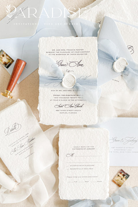 Announce your special day with a touch of coastal elegance and bohemian chic with this unique beach wedding invitations suite. Perfect for a seaside celebration, this elegant wedding stationery set combines classic details with a relaxed feel. Each invite is finished with a personalized wax seal, adding a luxurious, tactile element that makes a memorable first impression.