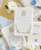 This exquisite wedding invitation set offers a blend of timeless charm and whimsical artistry. Each suite is printed on a luxurious handmade paper from our cotton rag suite, providing a rich, tactile feel. A delicate tassel is included with each invite, adding a playful pop of color and charm. The beautiful watercolor floral invites create a stunning and romantic preview of your special day.