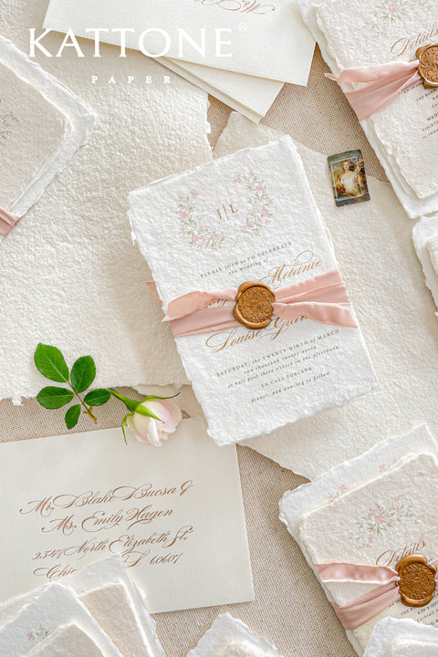 Announce your special day with the delicate, romantic charm of these handmade wedding invites. Perfect for a summer wedding, this suite features a soft and beautiful dusty pink color palette and delicate floral artwork. Each invitation is individually crafted, giving it a unique, tactile feel that you and your guests will appreciate. The combination of handcrafted artistry and a fresh, romantic design sets a beautiful tone for your celebration.