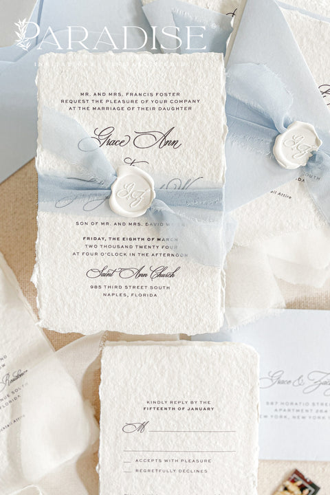 Announce your special day with a touch of coastal elegance and bohemian chic with this unique beach wedding invitations suite. Perfect for a seaside celebration, this elegant wedding stationery set combines classic details with a relaxed feel. Each invite is finished with a personalized wax seal, adding a luxurious, tactile element that makes a memorable first impression.