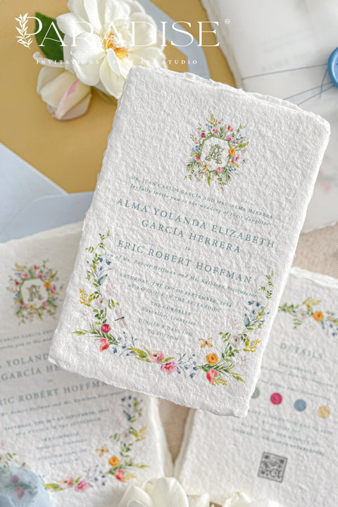 This exquisite wedding invitation set offers a blend of timeless charm and whimsical artistry. Each suite is printed on a luxurious handmade paper from our cotton rag suite, providing a rich, tactile feel. A delicate tassel is included with each invite, adding a playful pop of color and charm. The beautiful watercolor floral invites create a stunning and romantic preview of your special day.