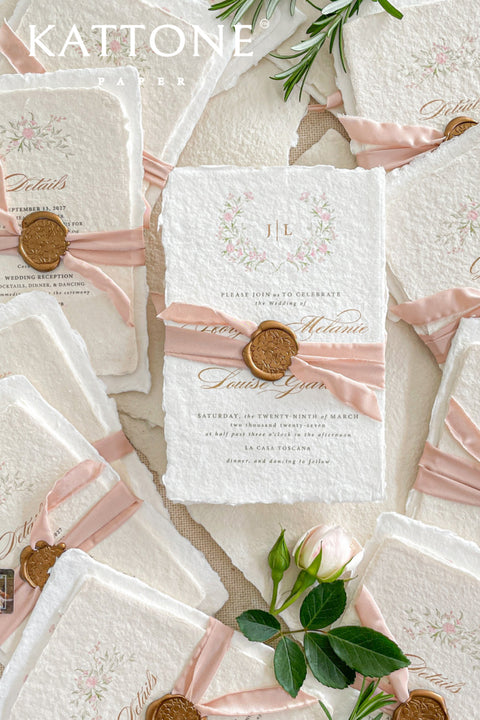 Announce your special day with the delicate, romantic charm of these handmade wedding invites. Perfect for a summer wedding, this suite features a soft and beautiful dusty pink color palette and delicate floral artwork. Each invitation is individually crafted, giving it a unique, tactile feel that you and your guests will appreciate. The combination of handcrafted artistry and a fresh, romantic design sets a beautiful tone for your celebration.