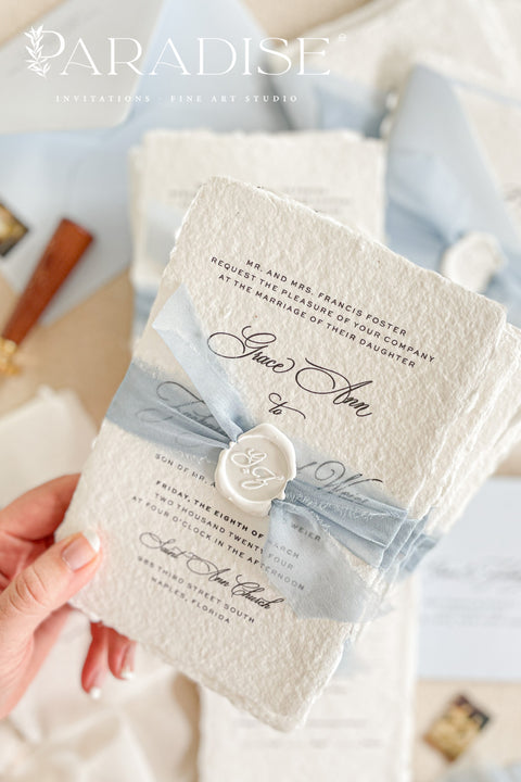 Announce your special day with a touch of coastal elegance and bohemian chic with this unique beach wedding invitations suite. Perfect for a seaside celebration, this elegant wedding stationery set combines classic details with a relaxed feel. Each invite is finished with a personalized wax seal, adding a luxurious, tactile element that makes a memorable first impression.