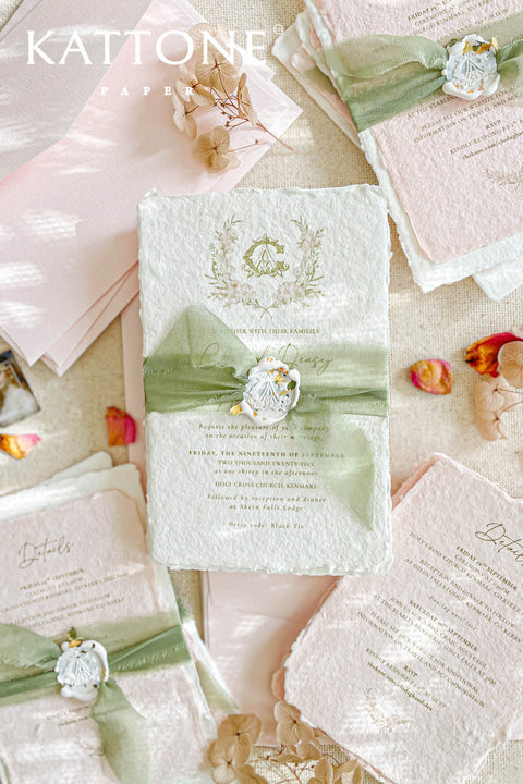 Elevate your wedding announcement with this exquisite invitation suite, meticulously crafted for a truly memorable impression. This set combines the luxurious, textured feel of handmade paper with the sophisticated details of premium silk ribbons and personalized wax seals. The entire suite is elegantly enclosed in beautiful coco linen petite pink envelopes, adding a final touch of charm and romance that your guests will adore from the moment they open their mail.