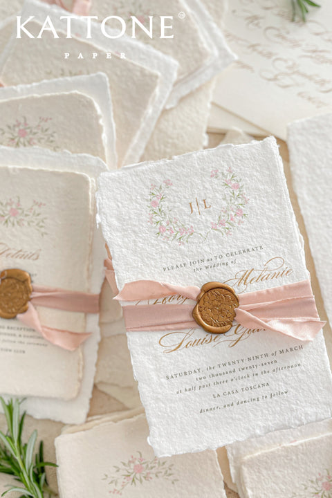 Announce your special day with the delicate, romantic charm of these handmade wedding invites. Perfect for a summer wedding, this suite features a soft and beautiful dusty pink color palette and delicate floral artwork. Each invitation is individually crafted, giving it a unique, tactile feel that you and your guests will appreciate. The combination of handcrafted artistry and a fresh, romantic design sets a beautiful tone for your celebration.