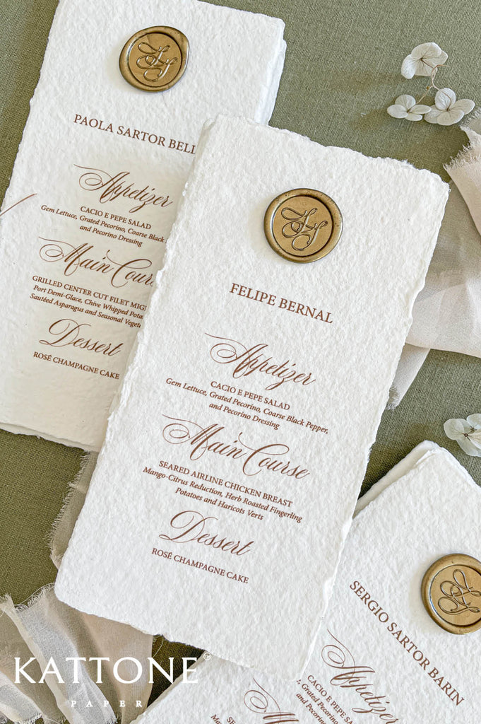 Elegant calligraphy menu layout featuring appetizer, main course and dessert sections in soft neutral ink tones.