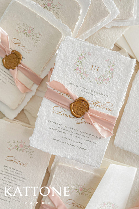 Announce your special day with the delicate, romantic charm of these handmade wedding invites. Perfect for a summer wedding, this suite features a soft and beautiful dusty pink color palette and delicate floral artwork. Each invitation is individually crafted, giving it a unique, tactile feel that you and your guests will appreciate. The combination of handcrafted artistry and a fresh, romantic design sets a beautiful tone for your celebration.