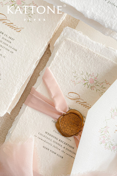 Announce your special day with the delicate, romantic charm of these handmade wedding invites. Perfect for a summer wedding, this suite features a soft and beautiful dusty pink color palette and delicate floral artwork. Each invitation is individually crafted, giving it a unique, tactile feel that you and your guests will appreciate. The combination of handcrafted artistry and a fresh, romantic design sets a beautiful tone for your celebration.