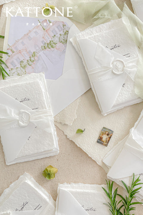 Introduce your wedding with the timeless and intimate feel of the Romantic Handmade Wedding Invitation. Each invite is a beautiful work of fine art, crafted on luxurious, artisan handmade paper with a natural deckle edge, giving it an organic, delicate texture that your guests will love to touch. The combination of handcrafted paper and a personalized, romantic design creates a bespoke feel that sets a deeply meaningful tone for your celebration.