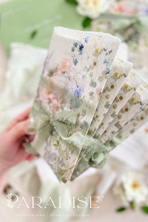 This exquisite wedding invitations suite offers a blend of fine artistry and natural elegance. Each invite is printed on luxurious handmade paper with beautiful deckled edges, providing a rich, tactile feel. The centerpiece is a custom, hand drawn watercolor venue illustration that captures the unique charm of your location, creating a truly memorable keepsake for your guests. This suite is perfect for a garden wedding, beautifully capturing the romantic and serene atmosphere.