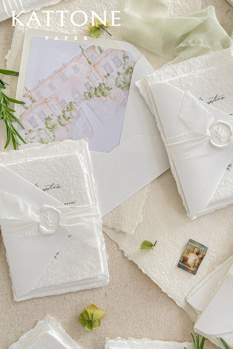 Introduce your wedding with the timeless and intimate feel of the Romantic Handmade Wedding Invitation. Each invite is a beautiful work of fine art, crafted on luxurious, artisan handmade paper with a natural deckle edge, giving it an organic, delicate texture that your guests will love to touch. The combination of handcrafted paper and a personalized, romantic design creates a bespoke feel that sets a deeply meaningful tone for your celebration.