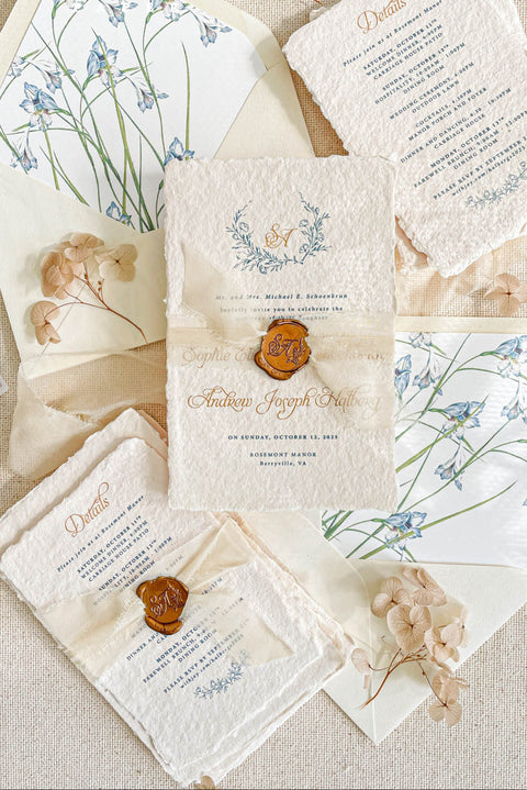 Announce your marriage with the perfect blend of natural texture and refined elegance with this custom handmade paper wedding invites suite. Designed for a boho rustic feel, this set also features a custom elegant aesthetic, making it ideal for a relaxed yet sophisticated celebration. Each invitation is a true work of art, with the luxurious feel of handmade paper providing a unique and personal touch that your guests will adore.