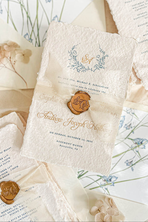 Announce your marriage with the perfect blend of natural texture and refined elegance with this custom handmade paper wedding invites suite. Designed for a boho rustic feel, this set also features a custom elegant aesthetic, making it ideal for a relaxed yet sophisticated celebration. Each invitation is a true work of art, with the luxurious feel of handmade paper providing a unique and personal touch that your guests will adore.