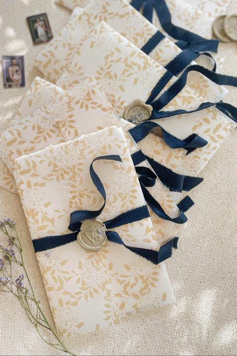 Announce your marriage with a romantic and modern touch that is also kind to the planet. This exquisite wedding invites suite features elegant modern calligraphy printed on luxurious handmade paper with a delicate deckle edge. As an eco-friendly choice, these invites combine contemporary design with sustainable craftsmanship, ensuring your stationery is as beautiful as it is responsible. The result is a stunning and truly romantic set of wedding stationery.