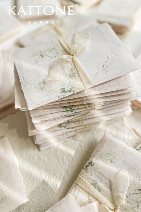 Announce your special day with the serene beauty of this wedding invitation set. Perfect for a garden wedding, each suite features a custom, hand-painted watercolor wedding venue illustration that beautifully captures the charm of your location. Printed on luxurious handmade paper, the invitations are finished with a personalized wax seal, adding a tactile and opulent detail that your guests will adore.
