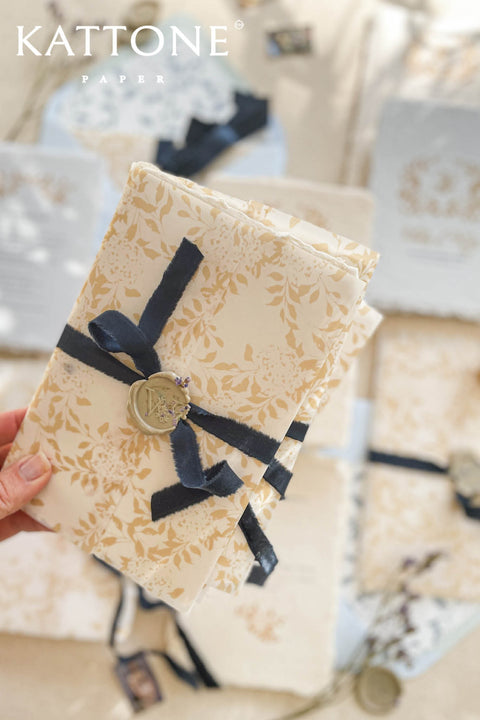 Announce your marriage with a romantic and modern touch that is also kind to the planet. This exquisite wedding invites suite features elegant modern calligraphy printed on luxurious handmade paper with a delicate deckle edge. As an eco-friendly choice, these invites combine contemporary design with sustainable craftsmanship, ensuring your stationery is as beautiful as it is responsible. The result is a stunning and truly romantic set of wedding stationery.