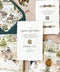 Embossed handmade paper wedding invitations with custom watercolor illustration, vellum wrap, and deckle edge cotton paper.
