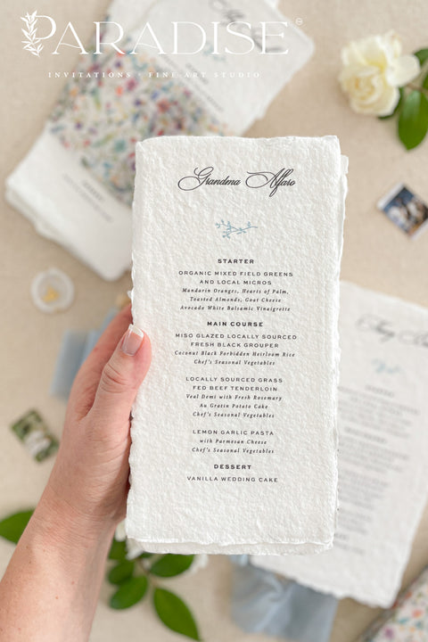Add a touch of botanical beauty and fine art elegance to your event with our handmade paper wedding menus, crafted from 100% cotton rag paper with delicately torn deckled edges. Each menu features a vibrant floral vellum wrap paired with a soft silk ribbon and wax seal, creating an exquisite balance between organic texture and romantic detail. The minimalist typography allows the floral design to shine, making these menus perfect for garden weddings, spring celebrations and outdoor receptions.