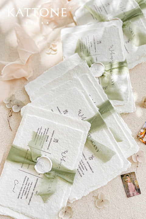 This exquisite wedding invitations suite offers a blend of natural elegance and modern sophistication. Perfect for a garden green wedding, these beautiful invites feature a chic, contemporary design printed on luxurious handmade cotton paper. The suite includes a beautifully designed wedding timeline, guiding your guests through your special day with a personal and artistic touch, all wrapped in a fresh and modern aesthetic.