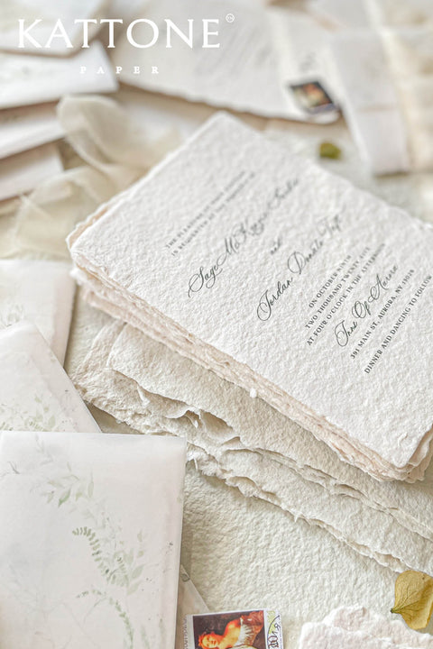 Announce your special day with the serene beauty of this wedding invitation set. Perfect for a garden wedding, each suite features a custom, hand-painted watercolor wedding venue illustration that beautifully captures the charm of your location. Printed on luxurious handmade paper, the invitations are finished with a personalized wax seal, adding a tactile and opulent detail that your guests will adore.