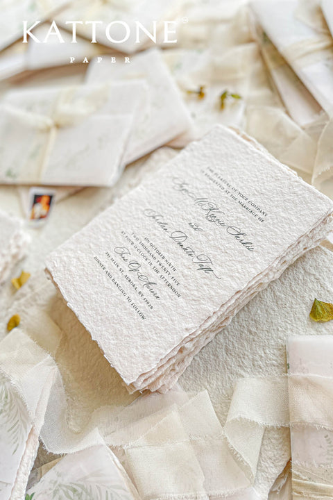 Announce your special day with the serene beauty of this wedding invitation set. Perfect for a garden wedding, each suite features a custom, hand-painted watercolor wedding venue illustration that beautifully captures the charm of your location. Printed on luxurious handmade paper, the invitations are finished with a personalized wax seal, adding a tactile and opulent detail that your guests will adore.