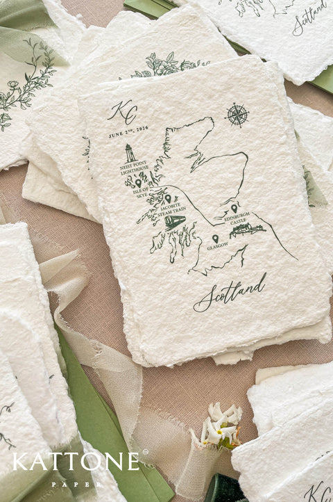 Custom Scotland map illustration printed on handmade paper featuring landmarks such as Isle of Skye, Edinburgh Castle and compass detail.