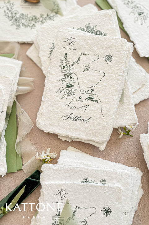Custom Scotland map illustration printed on handmade paper featuring landmarks such as Isle of Skye, Edinburgh Castle and compass detail.