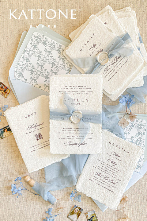Collection of wedding invitations and stationery items, assembled with silk ribbons and wax seals. envelope liners. Elevate your special day with our Briseis Handmade Paper Wedding Invites. Crafted with love and attention to detail, these elegant invitations blend rustic charm with modern design. Each piece is made from eco-friendly materials, ensuring a unique touch for your celebration. Perfect for intimate gatherings or grand affairs, our invites set the tone for your wedding. 