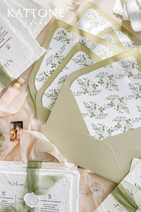 This exquisite wedding invitations suite offers a blend of natural elegance and modern sophistication. Perfect for a garden green wedding, these beautiful invites feature a chic, contemporary design printed on luxurious handmade cotton paper. The suite includes a beautifully designed wedding timeline, guiding your guests through your special day with a personal and artistic touch, all wrapped in a fresh and modern aesthetic.