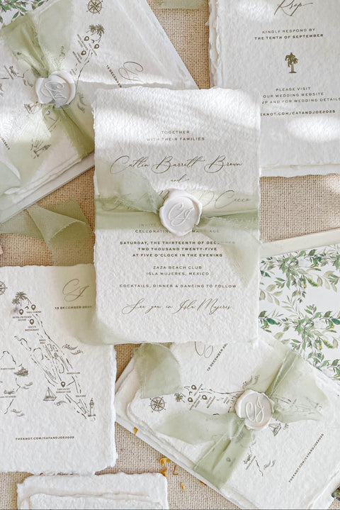 Announce your special day with the serene and natural beauty of these handmade paper wedding invitations. Perfect for a garden wedding or an outdoor celebration, this suite combines the luxurious, tactile feel of artisan paper with a delicate botanical design. The result is a truly romantic set of wedding stationery that will enchant your guests and beautifully set the tone for your special day.