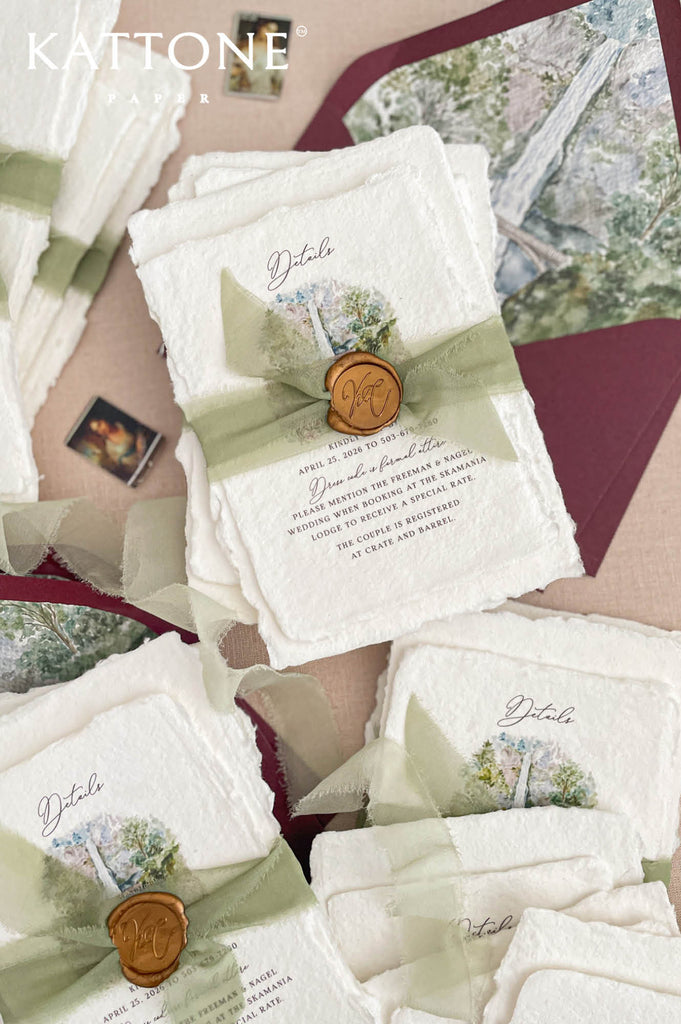 Complete luxury wedding invitation suite including handmade invitation, details cards with watercolor illustration, envelopes, silk ribbon and wax seal accents.