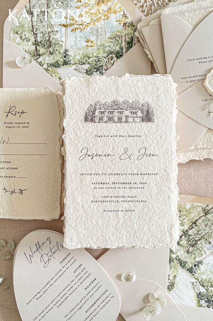 Romantic flat lay of luxury wedding stationery showcasing handmade paper invitations, scenic envelope liners, arch detail cards, envelopes, RSVP cards, and coordinating inserts.