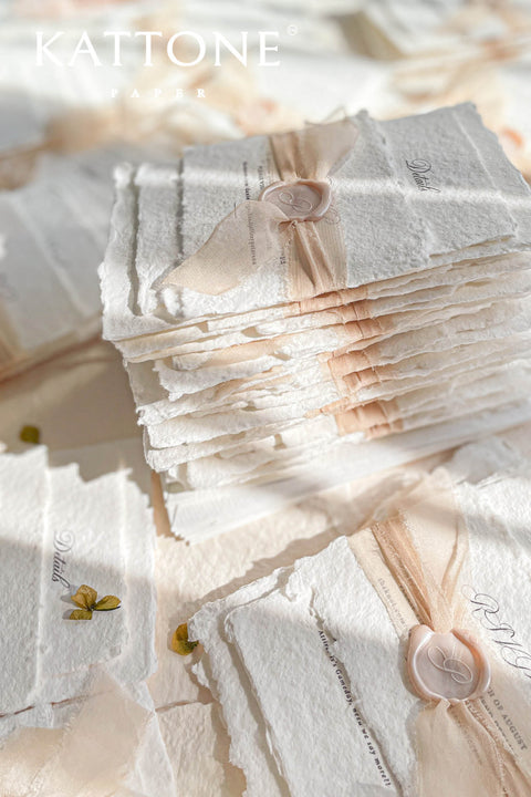This exquisite handmade paper invitations suite offers a blend of fine artistry and personal romance. Each invitation is a true work of art, featuring a custom, hand drawn wedding venue illustration that beautifully captures the unique charm of your location. The luxurious, textured paper and timeless design create a truly romantic wedding stationery set that will be cherished by your guests long after your special day.