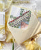 Soft yellow wedding envelopes with watercolor venue envelope liners styled with handmade paper, silk ribbon, and fine art stationery details.