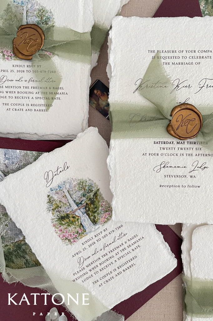 Close up of textured handmade cotton paper invitation showing organic deckled edges and elegant script typography.