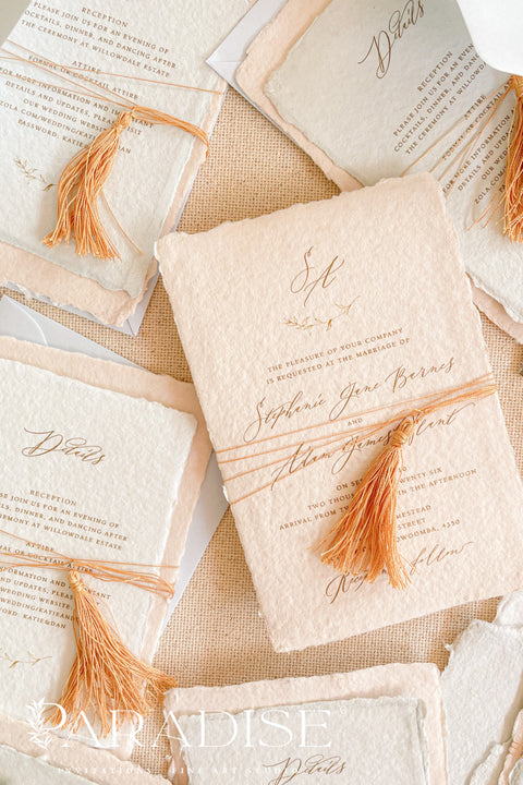 Invite your guests to your special day with the whimsical and elegant touch of this handmade paper wedding invites suite. Perfect for a garden wedding, these invitations feature a unique tassel detail, adding a pop of color and charm. The suite is printed on custom colored handmade paper, providing a rich, organic texture that sets a warm and inviting tone for your celebration.