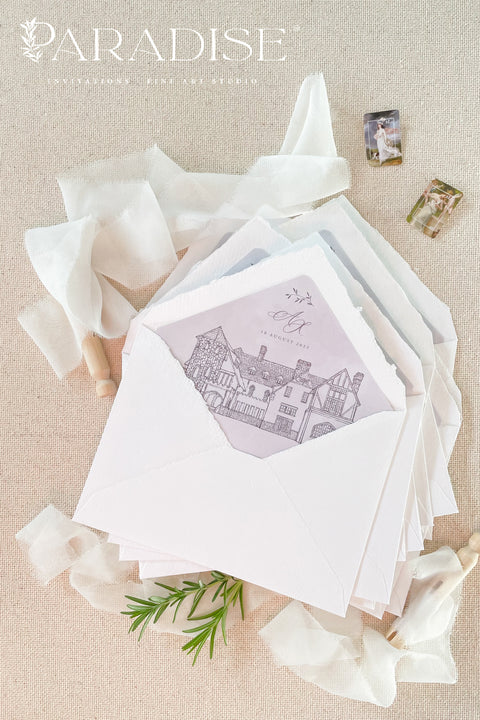 Stack of handmade paper envelopes with illustrated liners visible, highlighting natural texture, soft edges, and artisanal quality.