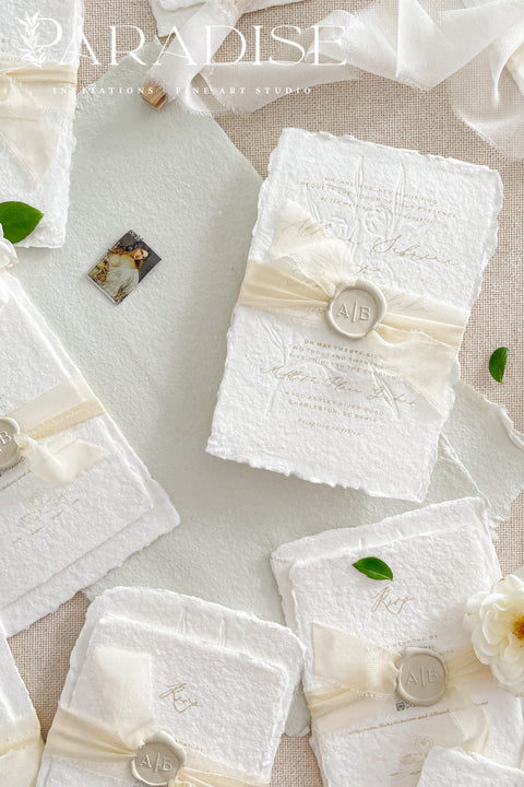 This exquisite wedding invites suite offers a blend of natural elegance and modern sophistication. Printed on luxurious handmade cotton paper in a soft ivory hue, each invitation features a delicate blind embossed floral design. A touch of refined artistry is added with elegant modern calligraphy, creating a truly classy wedding stationery set that beautifully hints at your special day.