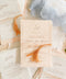 Invite your guests to your special day with the whimsical and elegant touch of this handmade paper wedding invites suite. Perfect for a garden wedding, these invitations feature a unique tassel detail, adding a pop of color and charm. The suite is printed on custom colored handmade paper, providing a rich, organic texture that sets a warm and inviting tone for your celebration.