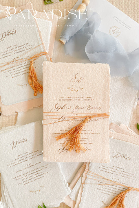 Invite your guests to your special day with the whimsical and elegant touch of this handmade paper wedding invites suite. Perfect for a garden wedding, these invitations feature a unique tassel detail, adding a pop of color and charm. The suite is printed on custom colored handmade paper, providing a rich, organic texture that sets a warm and inviting tone for your celebration.