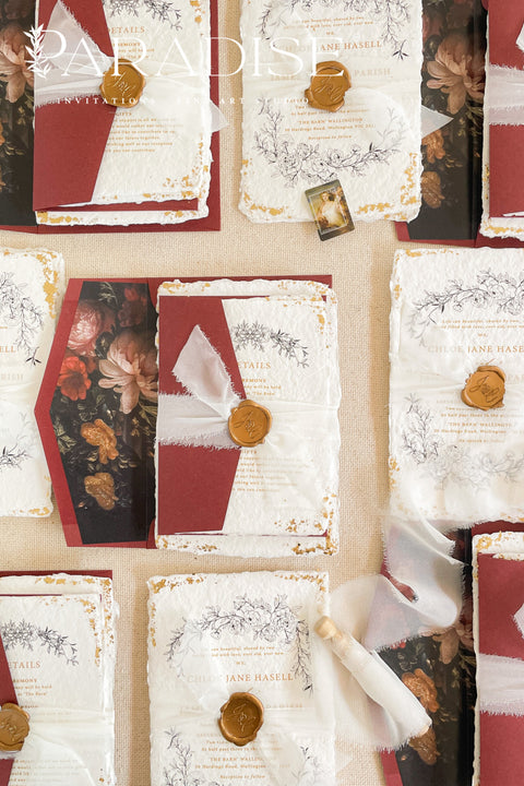 This exquisite wedding invitations suite offers a blend of natural texture and timeless charm. Each invite is printed on luxurious handmade paper with a delicate deckle edge, providing a rich, organic feel. The design is finished with a delicate golden leaf detail, adding a touch of understated elegance and luxury. The result is a truly memorable vintage style stationery set that beautifully hints at your special day.
